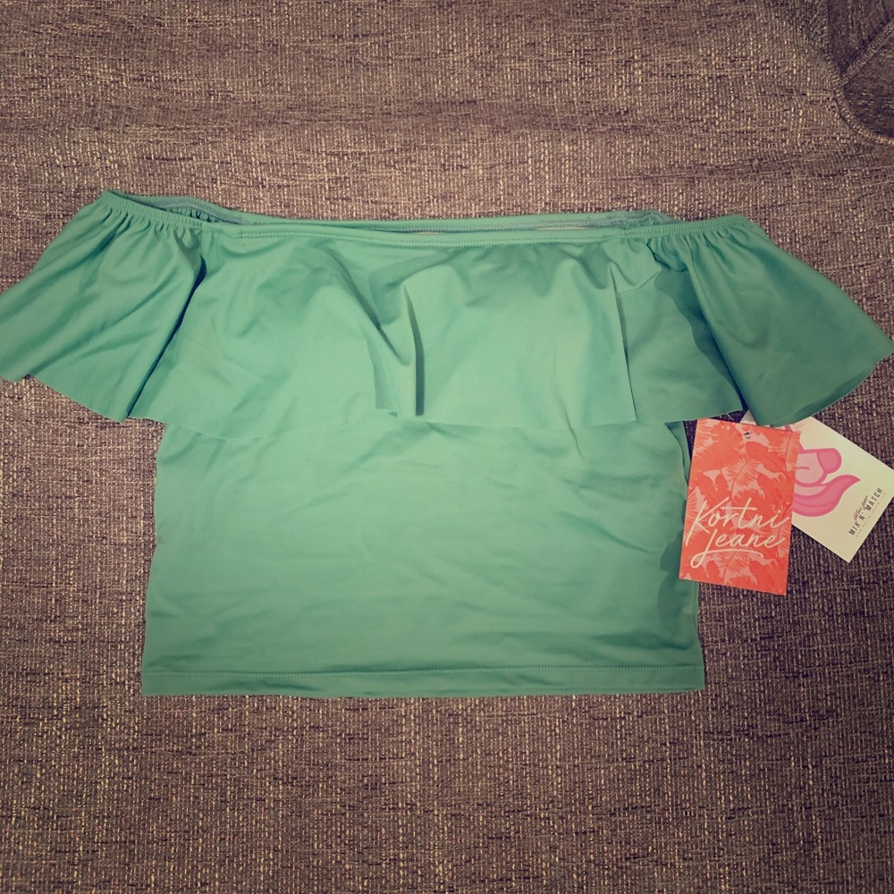 Kortni Jeane ruffled up swim top